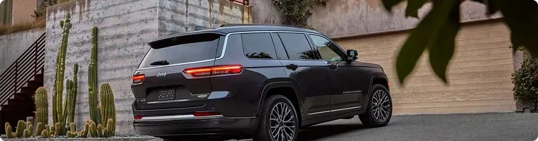 2026 Jeep Grand Cherokee Uconnect display compared with the Ford Explorer screen and driver-assist features